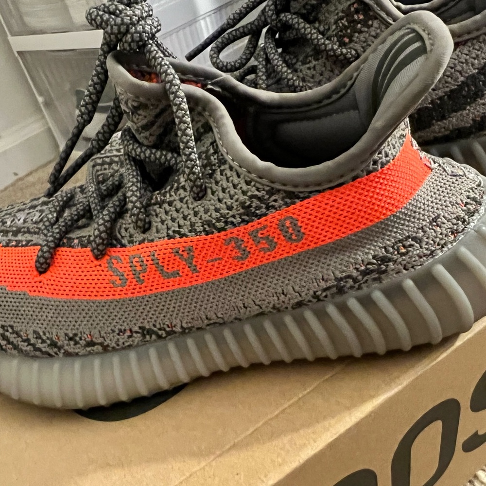 Yeezy Gray and Orange Athletic Shoes with Knit Fabric and Ribbed Sole